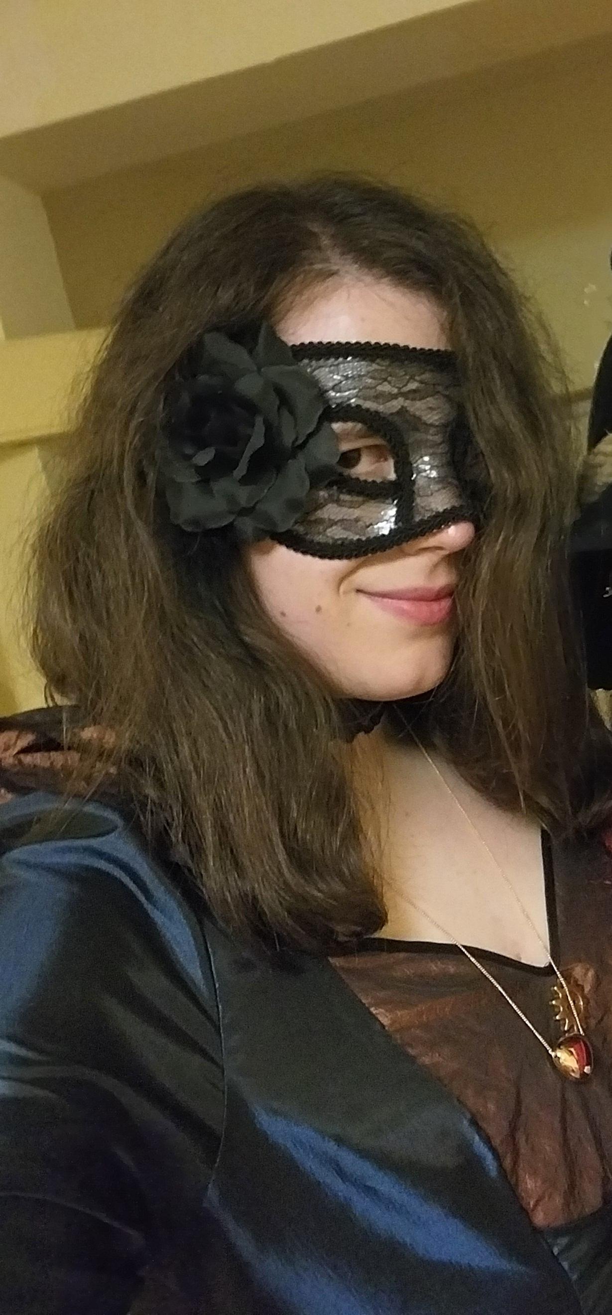 Selfie of me sideways (recut from a bigger photo posing with a very dear entity)
I wear a black translucent mask with stamps and a black rose on the right side, a purple choker with a rose on the left, a golden pendant "in a similar shape of a heart", a short translucent glove with patterns, a blue and maroon long dress, long translucent stockings with rose patterns, and shoes Selfie of me sideways (recut from a bigger photo posing with a very dear entity)
I wear a black translucent mask with stamps and a black rose on the right side, a purple choker with a rose on the left, a golden pendant "in a similar shape of a heart", a short translucent glove with patterns, a blue and maroon long dress, long translucent stockings with rose patterns, and shoes