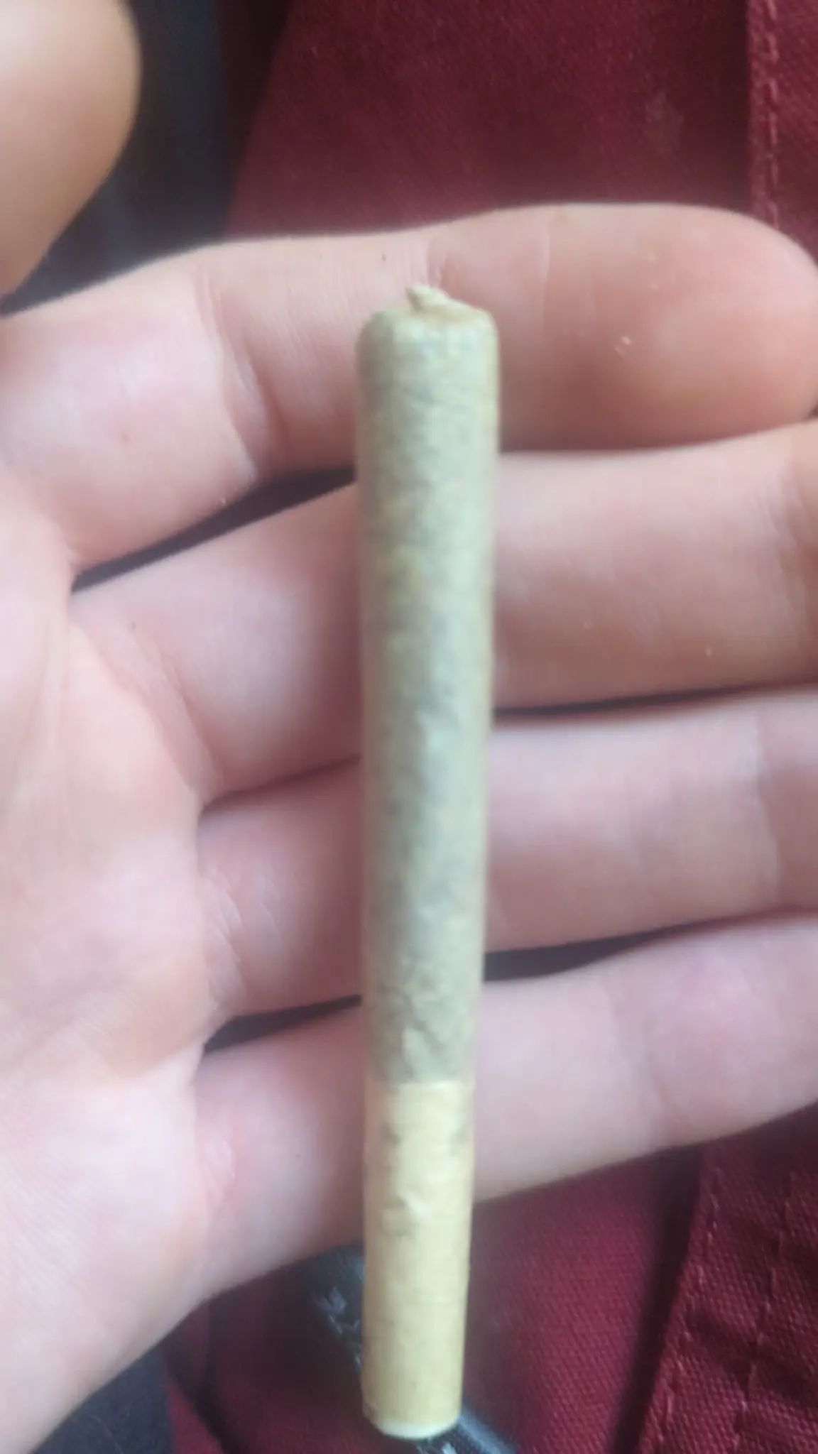 A picture of a hand holding a joint