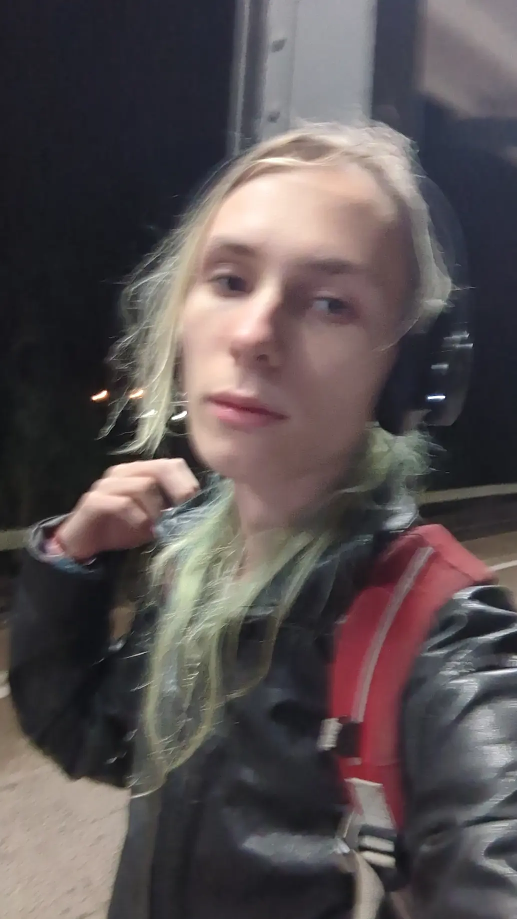 A picture of me wearing my black leather jacket and my red backpack at Magdeburg Neustadt